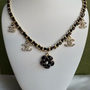 Chic Black and Gold Necklace with Iconic Charms